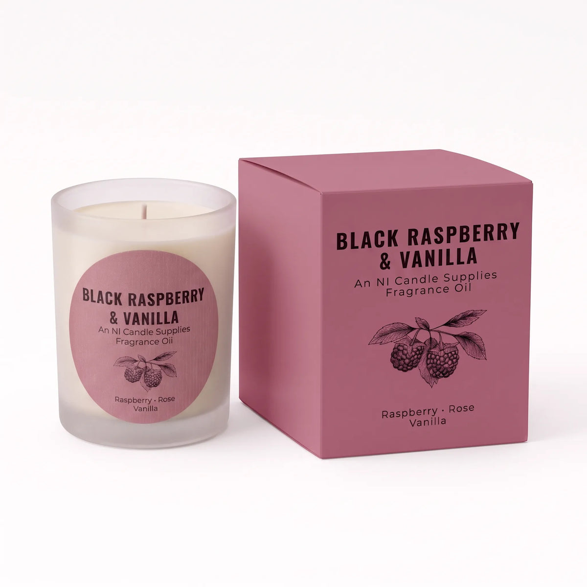 A frosted glass candle jar with cream wax and a pink circular label next to its matching dusty pink box, both printed with 'BLACK RASPBERRY & VANILLA' and a raspberry illustration. The label also includes 'An Ni Candle Supplies' and 'Fragrance Oil'.