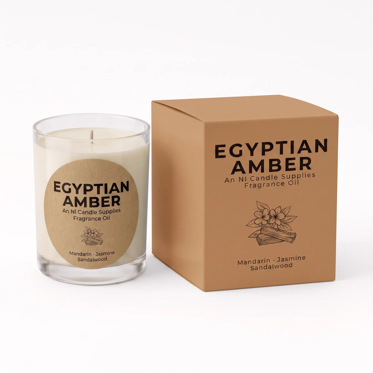 A clear glass jar candle with cream-colored wax and a round kraft paper label reading 'EGYPTIAN AMBER', shown next to its matching brown cardboard box on a white background.