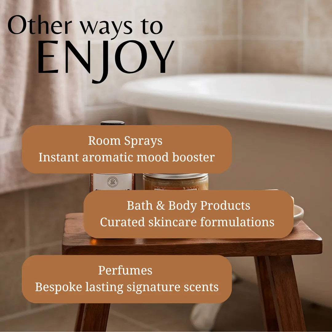 Promotional graphic with the text 'Other ways to ENJOY' over a softly blurred bathroom scene. A wooden stool holds a small bottle and a jar, with three rounded text boxes listing: Room Sprays, Bath & Body Products, and Perfumes.