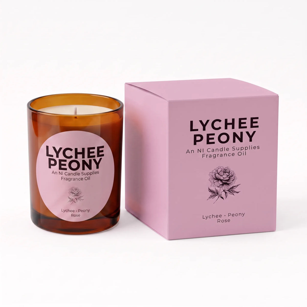 An amber glass jar candle with a pink circular label next to its matching pink packaging box, both labeled 'LYCHEE PEONY' by An Ni Candle Supplies, on a clean white background.