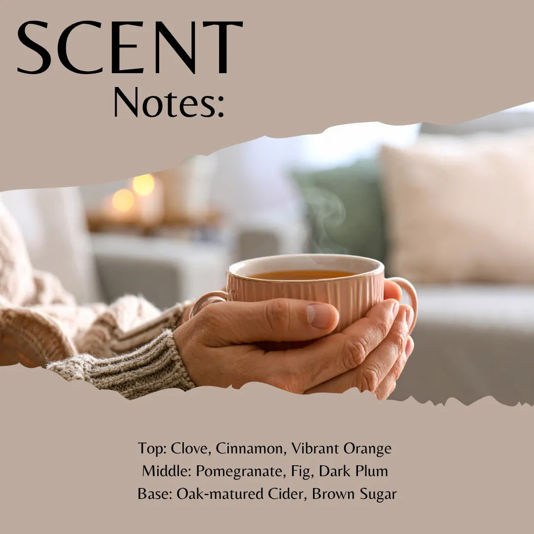 Scent profile graphic for a warm beverage blend, featuring a person in a beige sweater holding a pink mug in a cozy living room. The graphic has a beige background with torn-paper style borders, displaying the text 'SCENT Notes:' and scent notes: 'Top: Clove, Cinnamon, Vibrant Orange', 'Middle: Pomegranate, Fig, Dark Plum', 'Base: Oak-matured Cider, Brown Sugar'.