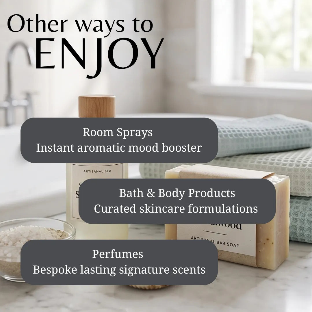 Promotional graphic for a fragrance and bath product collection, featuring a room spray bottle, a bar of soap, and a textured bath towel on a marble surface with overlaid text reading 'Other ways to ENJOY' and categories: Room Sprays, Bath & Body Products, and Perfumes.