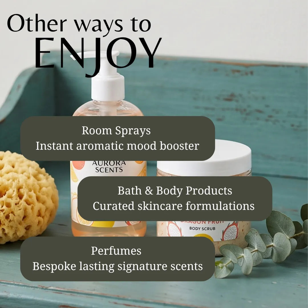 Promotional graphic for Aurora Scents showing a room spray bottle and a body scrub jar on a distressed teal wooden surface, with text overlays reading 'Other ways to ENJOY' and callouts for room sprays, bath & body products, and perfumes.