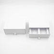 Two white drawer-style packaging boxes on a clean white background, with one closed and one open showing interior compartments.