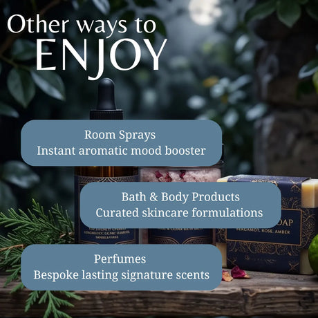 Promotional graphic for a fragrance and wellness product collection, showing a dark amber bottle with a dropper, a pink bath bomb, and a boxed bar of soap on a rustic wooden surface with green foliage in the background. Large text reads 'Other ways to ENJOY' with callouts for room sprays, bath & body products, and perfumes.