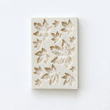 Silicone mould with leaf pattern on a white background
