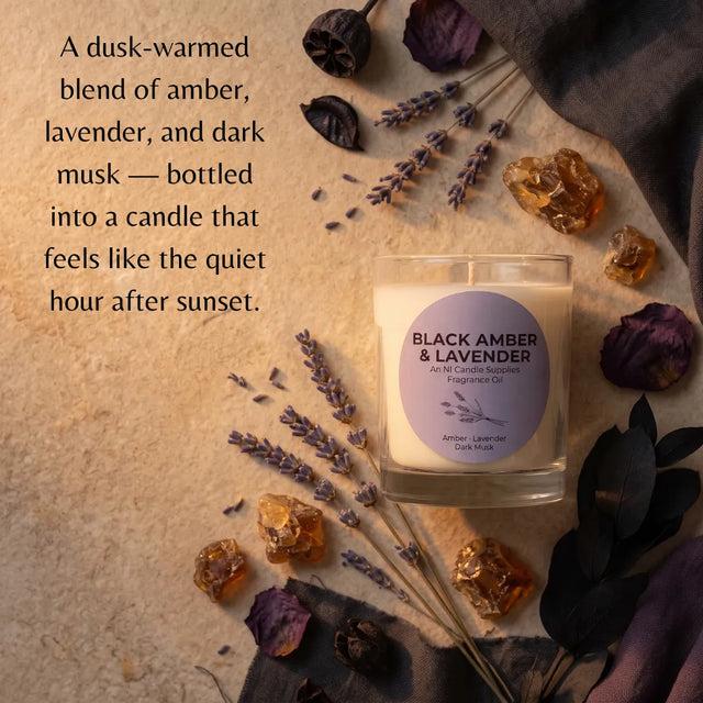 A glass jar candle labeled 'BLACK AMBER & LAVENDER' sits on a textured beige surface surrounded by dried lavender sprigs, amber crystals, and dark dried leaves. A descriptive text overlay appears on the left side.