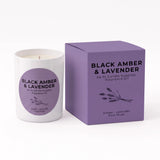 A white wax candle with a purple circular label next to its matching purple square box, both labeled 'BLACK AMBER & LAVENDER' by NI Candle Supplies, on a clean white background.