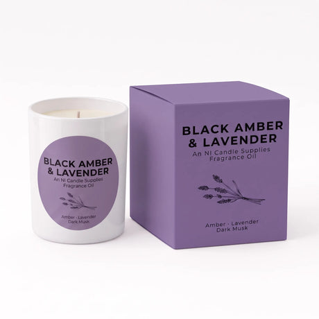 A white wax candle with a purple circular label next to its matching purple square box, both labeled 'BLACK AMBER & LAVENDER' by NI Candle Supplies, on a clean white background.