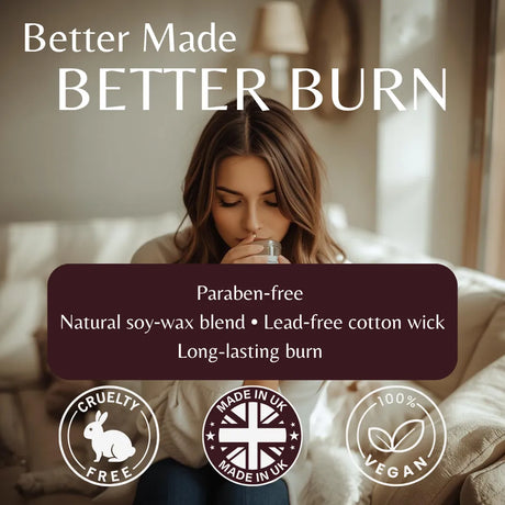 A woman sits on a sofa in a softly lit living room, holding a glass. Large text at the top reads 'Better Made BETTER BURN,' with a dark maroon banner below listing product benefits: 'Paraben-free, Natural soy-wax blend, Lead-free cotton wick, Long-lasting burn.