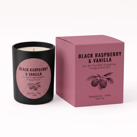 A black candle jar with a pink circular label next to its matching pink box, labeled 'Black Raspberry & Vanilla' by An Ni Candle Supplies, on a white background.