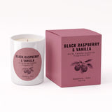 A white glass candle jar with a pink circular label next to its matching pink box, labeled 'Black Raspberry & Vanilla' by An Ni Candle Supplies.