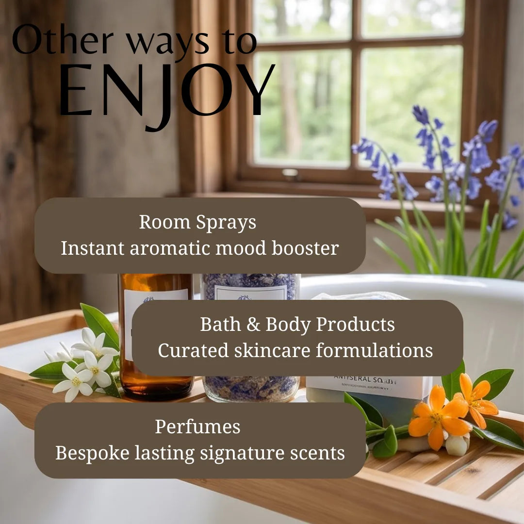 Promotional graphic with the text 'Other ways to ENJOY' over a bathroom scene. The image shows a wooden tray with bath and body items, including an amber bottle, a lavender jar, and a box labeled CRYSTAL SOIL, alongside flowers and a window in the background.