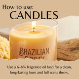 A lit candle in a clear glass jar with the words 'BRAZILIAN ROOTY' printed on the front, shown with large text reading 'How to use: CANDLES' and smaller text about fragrance oil load. The background is a warm beige with rustic props partially visible.