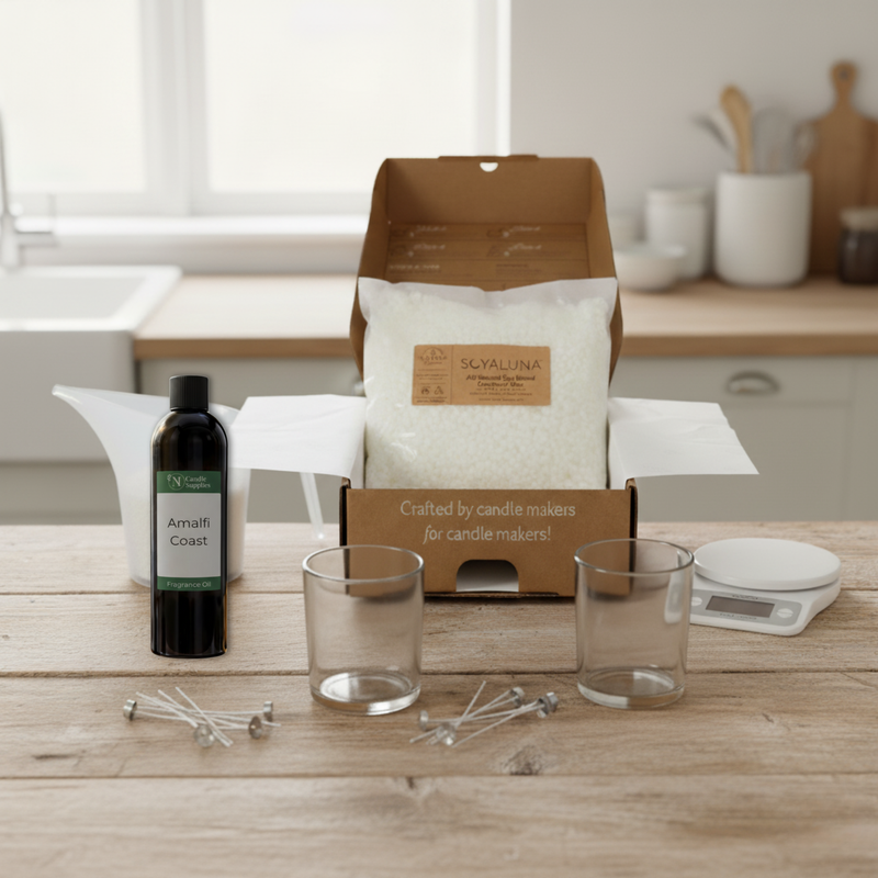 Candle-making kit with ingredients and tools on a wooden table.