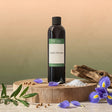 A bottle of 'Capri Shores' fragrance oil on a wooden platform with decorative elements.