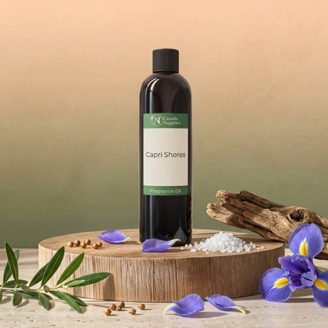 A bottle of 'Capri Shores' fragrance oil on a wooden platform with decorative elements.