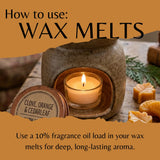 An informational graphic titled 'How to use: WAX MELTS' shows a small lit candle inside a rustic ceramic wax warmer, with a round product tin labeled 'CLOVE, ORANGE & CEDARLEAF' in the foreground and additional wax melts on a wooden surface.