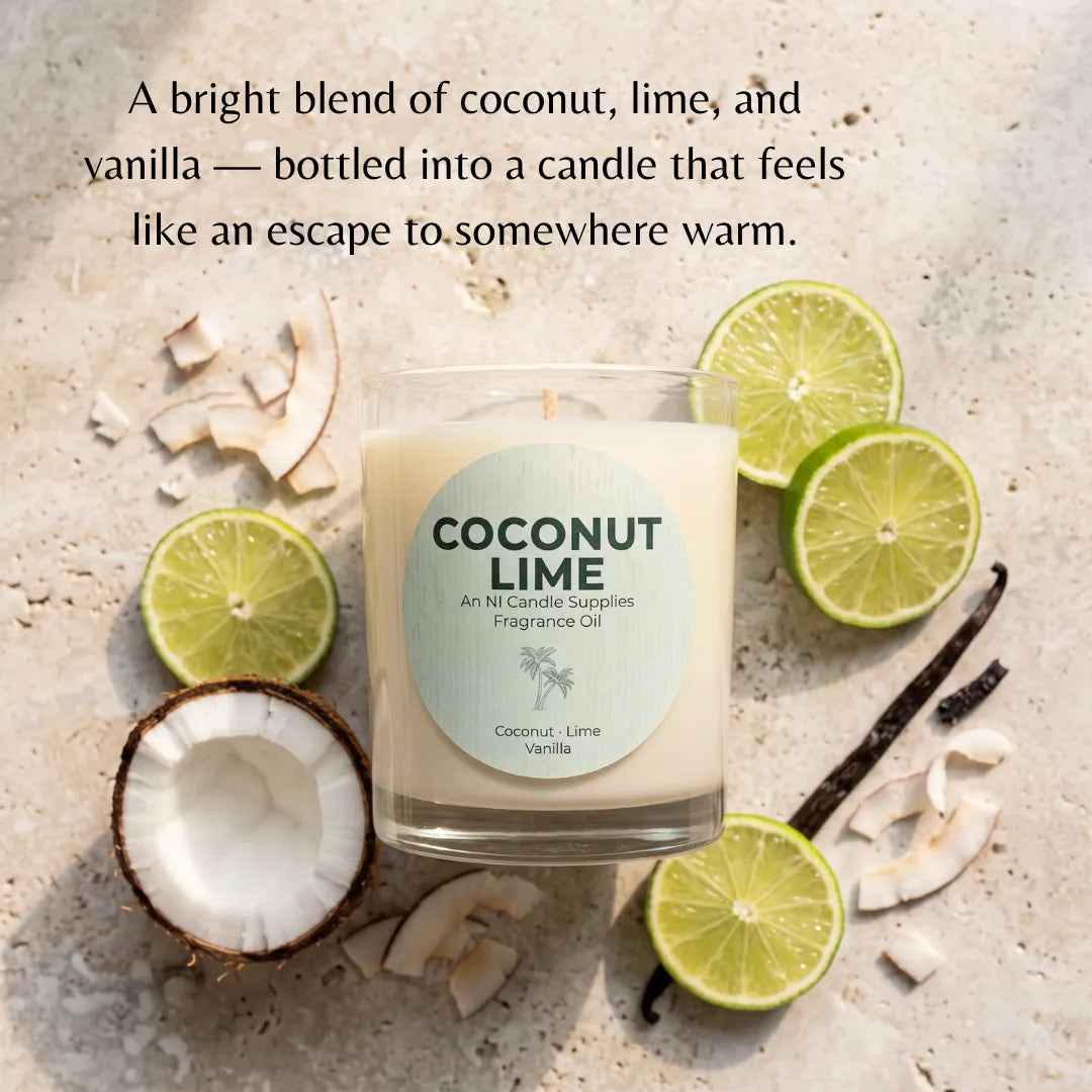 A coconut-lime fragrance oil candle in a clear glass jar, surrounded by sliced limes, coconut pieces, and vanilla beans on a light stone surface. Text at the top describes the scent as a bright blend of coconut, lime, and vanilla.