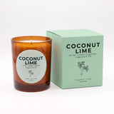 An amber glass jar candle with a white circular label next to its mint green packaging box, both printed with the text 'COCONUT LIME' and 'Coconut-Lime Vanilla' with a small palm tree illustration. The brand 'An Ni Candle Supplies' is visible on both the label and the box.