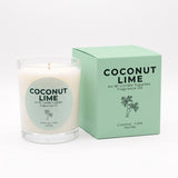 A coconut lime fragrance oil candle in a clear glass jar next to its mint green packaging box, both featuring the brand name An Ni Candle Supplies and the scent name Coconut Lime.
