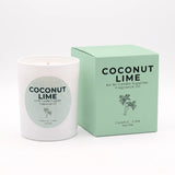 A white candle jar with a round light green label next to its mint green packaging box, both printed with the text 'COCONUT LIME' and 'Coconut-Lime Vanilla' with a small palm tree illustration.