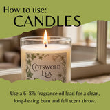 Candle with 'Cotswold Lea' label on a green background with text on how to use candles.