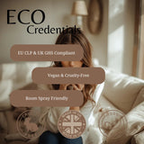 A promotional graphic for 'ECO Credentials' featuring a woman sitting on a beige sofa in a softly lit room. Three rounded brown text boxes highlight product claims: 'EU CLP & UK GHS Compliant', 'Vegan & Cruelty-Free', and 'Room Spray Friendly'.