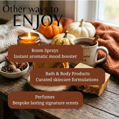 Promotional graphic with the text 'Other ways to ENJOY' over a styled autumn tabletop scene. The scene includes a lit candle, a mug with a cinnamon stick, pumpkins, a soap bar, spices, and layered brown text boxes listing product categories: Room Sprays, Bath & Body Products, and Perfumes.
