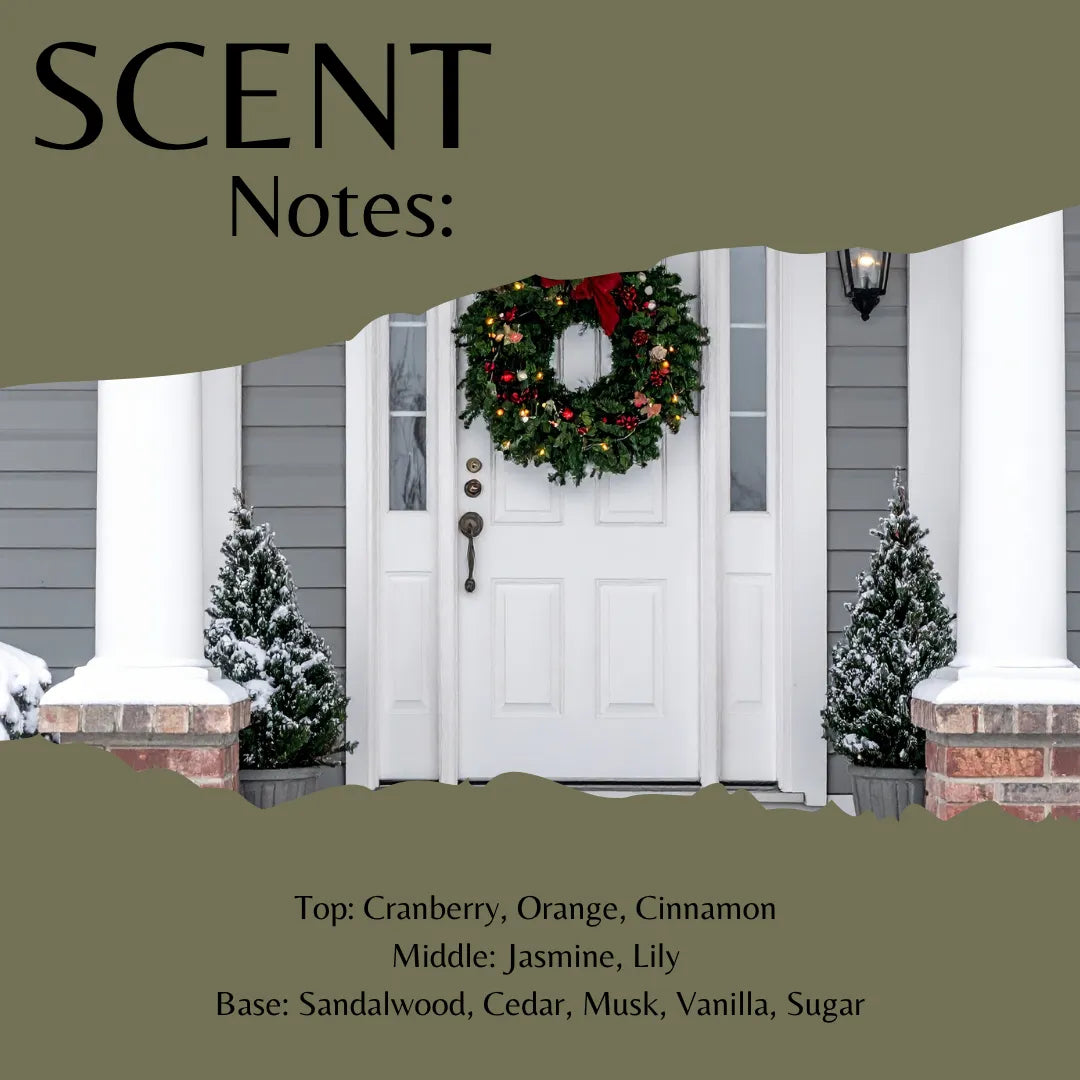 Scent Notes graphic showing a white front door with a green holiday wreath, snow-dusted small trees, and olive-green text panels listing seasonal fragrance notes: cranberry, orange, cinnamon, jasmine, lily, sandalwood, cedar, musk, vanilla, and sugar.