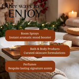 Promotional graphic for bath and body products in a cozy holiday bathroom setting. Text overlays read 'Other ways to ENJOY' and list 'Room Sprays', 'Bath & Body Products', and 'Perfumes'.