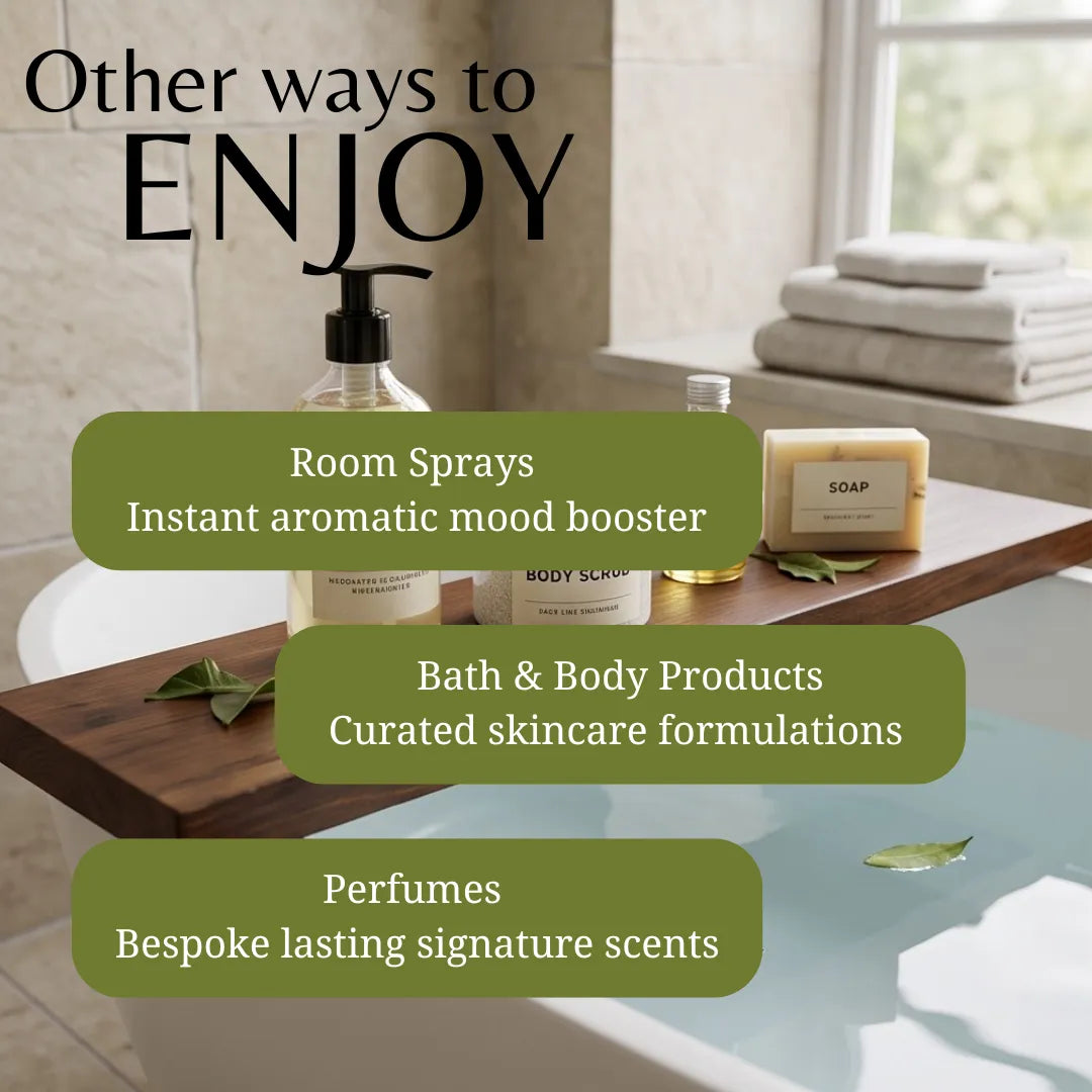 Promotional graphic for a bath and body product collection, showing a wooden caddy over a bathtub with room spray, body wash, soap, and folded towels in a bathroom setting. Text overlays read 'Other ways to ENJOY', 'Room Sprays', 'Bath & Body Products', and 'Perfumes'.