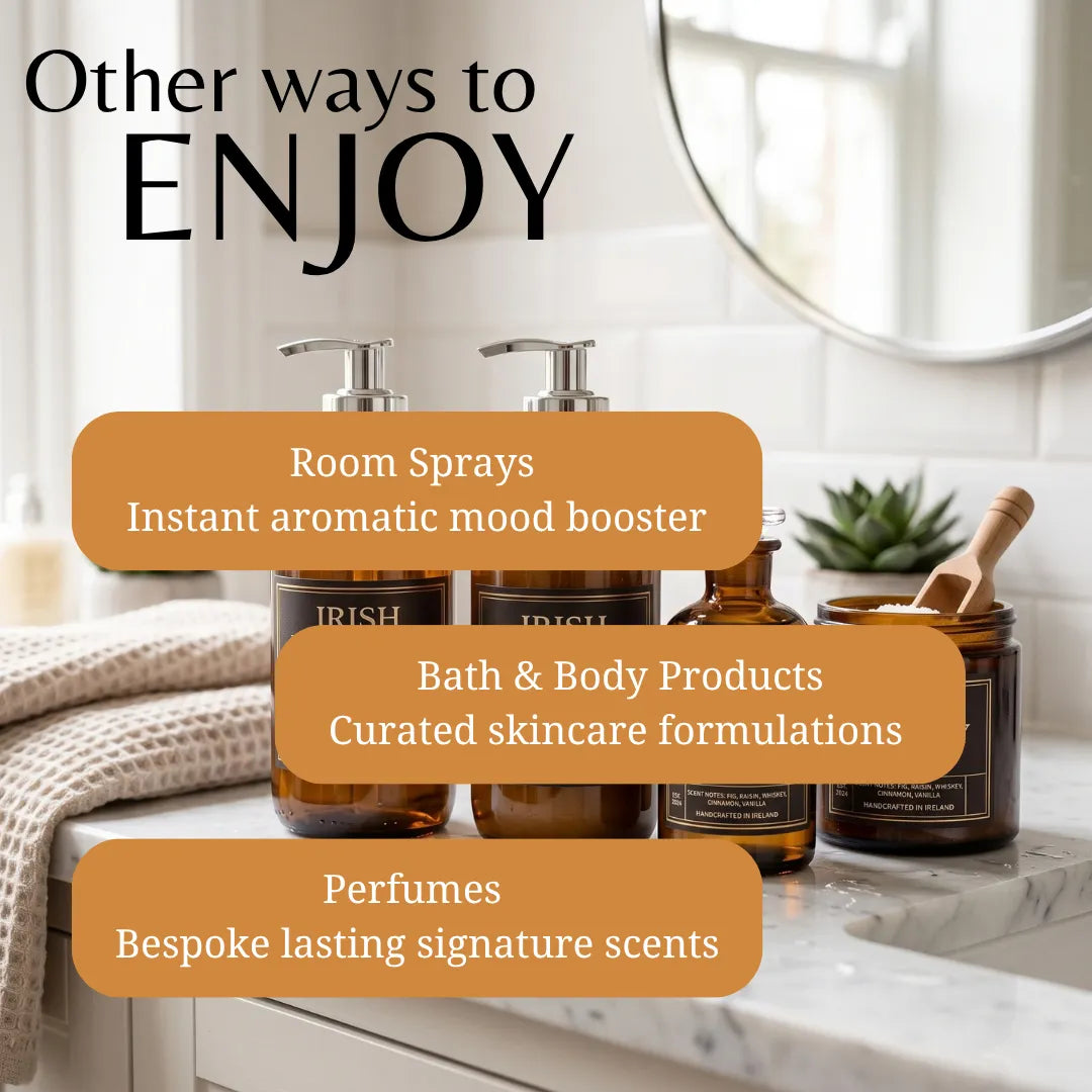 A promotional graphic for bath, body, and room fragrance products on a bathroom counter. Three amber glass bottles with pump dispensers are shown alongside a jar with a wooden scoop, with overlaid text reading 'Other ways to ENJOY' and callouts for room sprays, bath & body products, and perfumes.