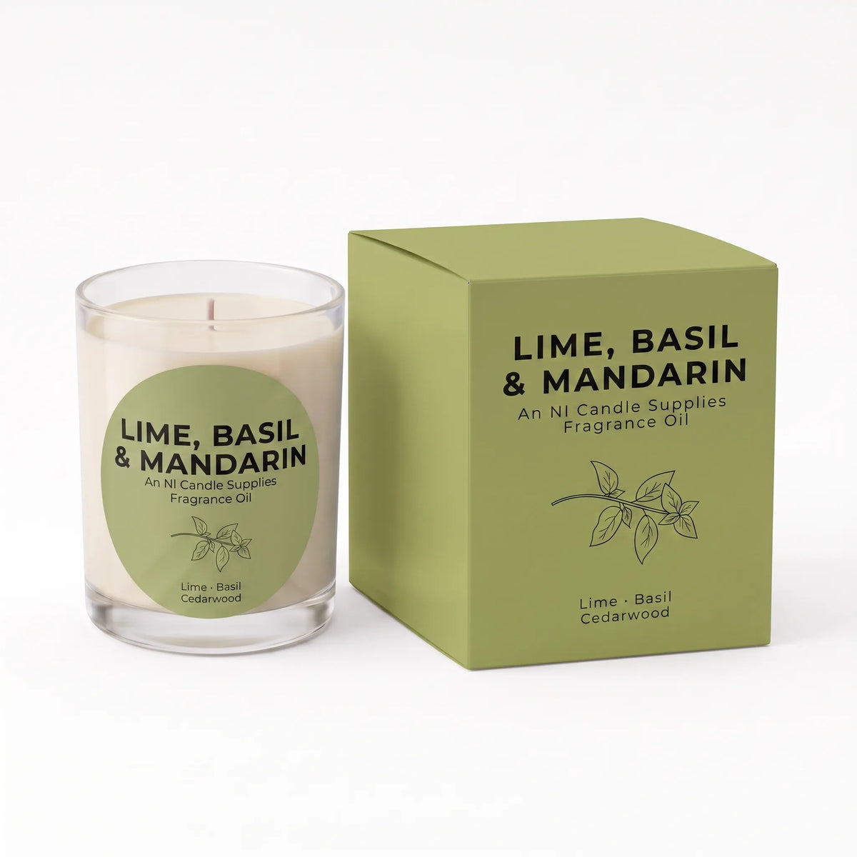A glass jar candle with a white wax fill and a green circular label, shown next to its matching olive green square box. The label and box read 'LIME, BASIL & MANDARIN' and indicate fragrance oil by An Ni Candle Supplies.
