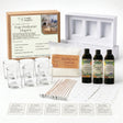 Melt-making kit with glass containers, wicks, and essential oils on a white surface.