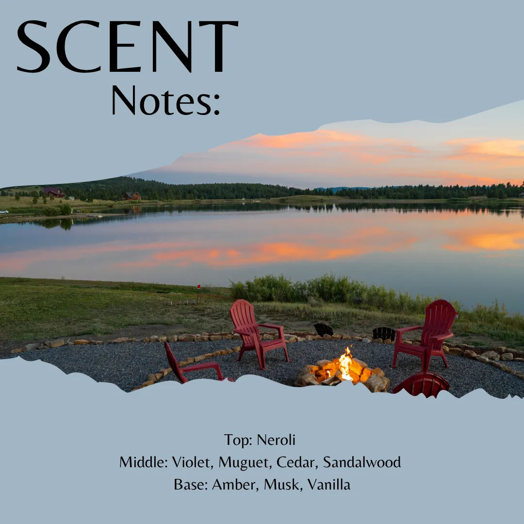 Scent Notes: cover art featuring a scenic lake sunset with red Adirondack chairs around a campfire, plus text listing fragrance notes: Top: Neroli, Middle: Violet, Muguet, Cedar, Sandalwood, Base: Amber, Musk, Vanilla.