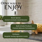 Promotional graphic for a bath and body product line, showing a pump bottle, a jar of body cream, and a sponge on a countertop with text overlays reading 'Other ways to ENJOY', 'Room Sprays', 'Bath & Body Products', and 'Perfumes'.