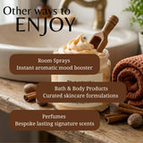 A styled promotional graphic showing a jar of whipped cream or lotion on a wooden surface with cinnamon sticks, a rolled towel, and a sink in the background. Large text reads 'Other ways to ENJOY' with three brown callout boxes listing: Room Sprays, Bath & Body Products, and Perfumes.
