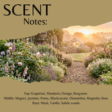 Scent Notes graphic showing a garden path at sunrise with flowers on both sides and text listing fragrance notes: Grapefruit, Mandarin, Orange, Bergamot, Muguet, Jasmine, Peony, Blackcurrant, Osmanthus, Magnolia, Rose, Musk, Vanilla, and Subtle woods.