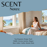 A fragrance notes graphic with a torn-paper effect showing a woman sitting on a bed by large windows with a beach and ocean view. The top reads 'SCENT Notes:' and the bottom lists fragrance notes: Top: Bergamot, Orange, Peach; Middle: Coconut, Jasmine, Muguet; Base: Amber, Vanilla, Almond, Musk.