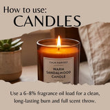An instructional graphic titled 'How to use: CANDLES' shows a lit amber glass candle jar labeled 'CALM HARVEST WARM SANDALWOOD CANDLE' on a tabletop, with a small succulent and soft home background. Text below explains fragrance oil loading for candle burn.