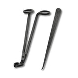 Black metal tools with decorative patterns on a white background