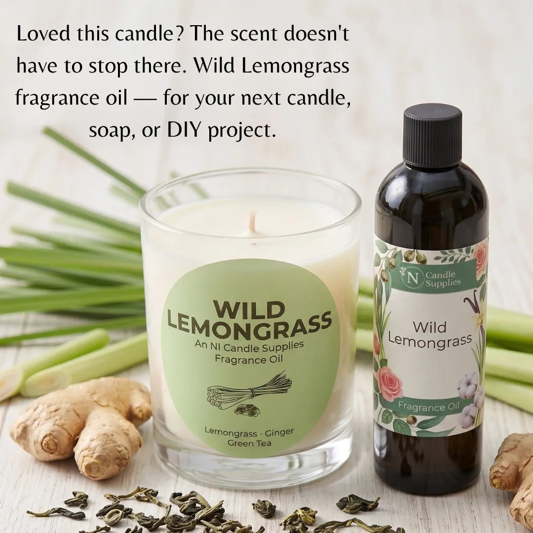 A candle jar and fragrance oil bottle labeled Wild Lemongrass, styled with lemongrass stems, ginger roots, and loose dried leaves on a light wood surface. Text at the top reads, 'Loved this candle? The scent doesn't have to stop there.