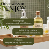 A styled product display featuring Wild Frangipani room spray and bath/body products on a wooden tray in a bathroom setting, with text overlays describing product categories.