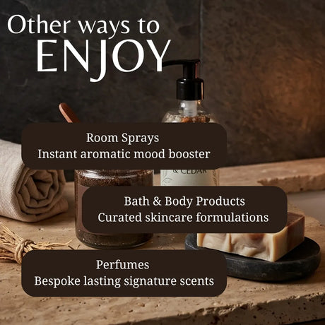 Promotional graphic for a collection of home and body products, featuring a clear pump bottle, a jar, a rolled towel, and a bar of soap on a rustic stone surface. White text at the top reads 'Other ways to ENJOY' with three dark brown text boxes listing 'Room Sprays', 'Bath & Body Products', and 'Perfumes'.