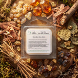 A clear plastic clamshell package labeled 'Wise Men Wax Melt Samples' by Candle Supplies, placed on a styled natural background with wood chips, moss, resin pieces, and dried botanicals.