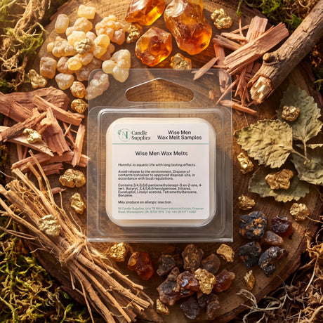 A clear plastic clamshell package labeled 'Wise Men Wax Melt Samples' by Candle Supplies, placed on a styled natural background with wood chips, moss, resin pieces, and dried botanicals.